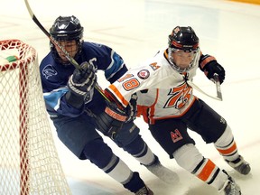 Essex 73's Josh Pope-Ferguson, right, tangles with Wheatley Sharks Braydon Davis, left, in Game 1 of the Bill Stobbs Division quarter-final series in the Provincial Junior Hockey League playoff series.