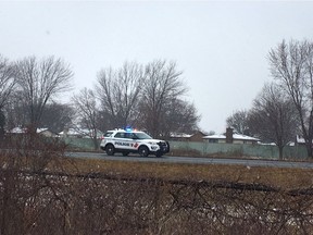 A Windsor police cruiser is seen stopped on E.C. Row Expressway on Thursday, Feb. 13, 2020. Police closed the expressway between Lauzon Parkway and Banwell Road to investigate.