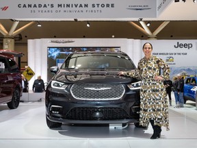 Mary Ann Capo is seen next to the Chrysler Pacifica Pinnacle at the Canadian International AutoShow in Toronto.