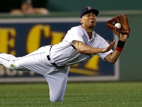 Mookie Betts of the Boston Red Sox catches a ball hit by Kevin Pillar of the Toronto Blue Jays in the eighth inning at Fenway Park  on Sept. 6, 2014 in Boston, Massachusetts.
