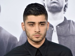 Singer Zayn Malik arrives at the premiere of Universal Pictures and Legendary Pictures' "Straight Outta Compton" at the Microsoft Theatre on August 10, 2015 in Los Angeles, California.