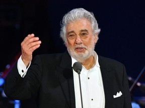 In this file photo taken on August 28, 2019 Spanish tenor Placido Domingo gestures as he performs during his concert in the newly inaugurated sports and culture centre 'St Gellert Forum' in Szeged, southern Hungary.