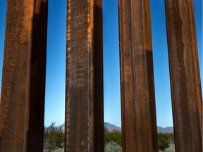 The words "Atlas Tube" engraved on a bollard of border wall east of the Lukeville port of entry, on Feb. 4, 2020.