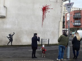 A suspected new mural by artist Banksy is pictured in Marsh Lane in Bristol, Britain, February 13, 2020. (REUTERS/Rebecca Naden)