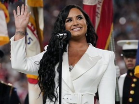 Demi Lovato sings the U.S. national anthem before Super Bowl LIV between the Chiefs and 49ers at Hard Rock Stadium, in Miami, on Feb. 2, 2020.