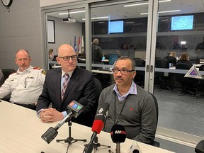 Dr. Wajid Ahmed, Medical Officer of Health with the Windsor-Essex County Health Unit, addresses media at the City of Windsor's Emergency Operations Centre on Feb. 28, 2020. Windsor Mayor Drew Dilkens and Chief Bruce Krauter of Essex-Windsor EMS look on.