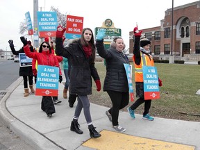 Public elementary school teachers and supporters picket at John Campbell Public School in Windsor on Jan. 29, 2020.