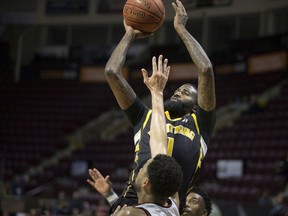 WINDSOR, ONT:. FEBRUARY 2, 2020 -- London's Terry Thomas takes a shot over Windsor's Ryan Anderson in NBL Canada action between the Windsor Express and the London Lightning at the WFCU Centre, Sunday, February 2, 2020.