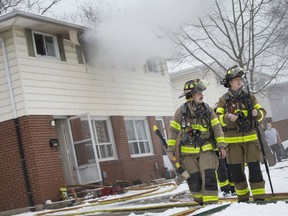 Fire crews work at the scene of a serious house fire in the upper unit bedroom at 1518 Curry Ave. on Feb. 6, 2020.