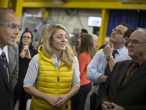 Jonathan Azzopardi, President of Laval, left, gives a tour of the shop floor to MP Melanie Joly, Minister of Economic Development, centre, and MP for Windsor-Tecumseh, Irek Kusmierczyk, before a funding announcement, Wednesday, February 12, 2020.