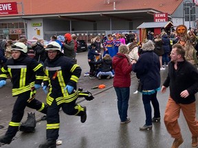 People react at the scene after a car ploughed into a carnival parade injuring several people in Volkmarsen, Germany February 24, 2020. (Elmar Schulten/Waldeckische Landeszeitung via REUTERS)