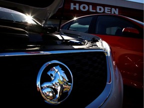 FILE PHOTO: Holden cars are pictured at a dealership located in the Western Australian city of Perth, December 12, 2013. General Motors Co said it would  wind down operations in Australia and New Zealand and retire the Holden brand as part of a retreat from unprofitable markets.