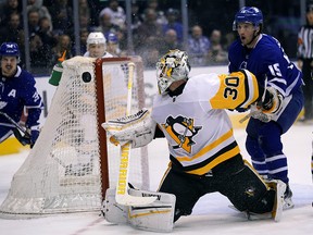 Pittsburgh Penguins goaltender Matt Murray (30) makes a save on Toronto Maple Leafs forward Alexander Kerfoot (15) at Scotiabank Arena. (John E. Sokolowski-USA TODAY Sports)