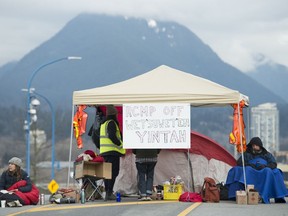 Protesters block the road access to one of Vancouver's port entrances in Vancouver Sunday, February 9, 2020. The protesters who are standing in solidarity with the Wet'suwet'en members opposed to the LNG pipeline in northern British Columbia are on day 4 of blocking the main ports in Vancouver.