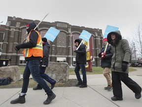 Local members with the Ontario English Catholic Teachers' Association participate in a one-day strike in front of Catholic Central High School in Windsor on Tuesday, February 4, 2020.