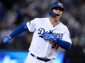 In this Oct. 3, 2019, file photo, Los Angeles Dodgers left fielder Joc Pederson celebrates while rounding the bases off a solo home run during the eighth inning in game one of the 2019 NLDS playoff baseball series against the Washington Nationals at Dodger Stadium in Los Angeles.