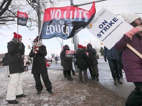 Public high school teachers and supporters picket near the Kennedy Collegiate Institute in Windsor on Jan. 8, 2020.