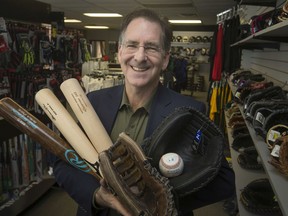 Windsor West MP, Brian Masse, pictured at Nantais Athletics with a handful of bats and gloves, is encouraging more youth participation in baseball.