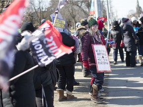Elementary and secondary teachers and education workers with the public, French and Catholic school boards held a one-day strike across Ontario on Friday. Some of the protesters who hit the streets are shown here on Tecumseh Road East in front of Kennedy Collegiate.