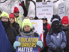 Striking teachers, education workers, support staff and supporters are shown on Thursday, February 13, 2020, in front of Kennedy Collegiate Institute in Windsor.