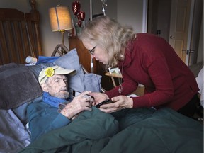 Pamela Courtenay-Hall speaks to her father Thomas Courtenay, 89, at his Windsor residence less than two hours before his medically assisted death. Courtenay had a life-long dream of finishing his novel The High Gate. It's a work of historical fiction life on the factory floor in an auto plant. With the help of Pamela he was able to complete the novel recently.