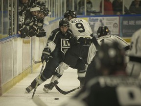 LaSalle's Derek Berdusco and Komoka's Cameron Welch collide at centre iced during Sunday's game between the LaSalle Vipers and Komoka Kings at the Vollmer Complex on Sunday.