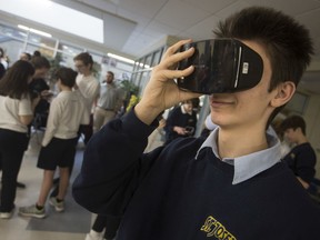 Sal Bianco, a Grade 10 student at St. Joseph's Catholic High School, tries on a pair of virtual reality glasses during a press event for the launch of Workforce WindsorEssex' virtual reality career resources, Wednesday, February 26, 2020.