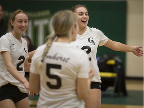 General Amherst's Emma MacVoy, Brynlee Ammonite, and Allison Dufour, celebrate a point. The Bulldogs were the last local team to compete in Windsor and Essex County at the OFSAA girls' AA volleyball championship in Kingsville on March 10th.