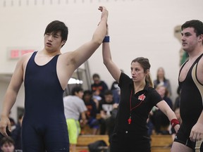 In a repeat of the WECSSA final, Massey's Roger Li, left, defeated Holy Names' Jake Goldman, at right, in the gold-medal final of the boys' 130kg division at the OFSAA boys' wrestling championships.