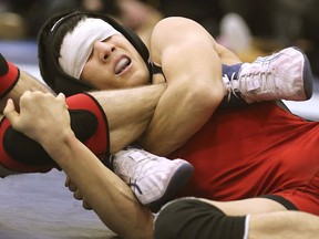 Despite having his vision impaired, L'Essor's Gabriel Sementelli managed to defeat L'Essor's Robert Unholzer to win the boy's 54kg division on Wednesday at the WECSSAA wrestling championships.