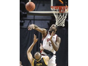 Windsor Express centre Sam Muldrow, blocks a shot by London Lightning forward Cameron Forte during Wednesday's game at the WFCU Centre.