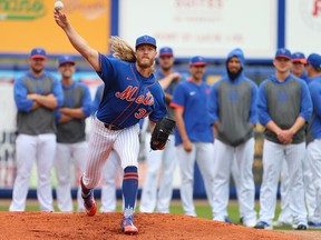 Pitcher Noah Syndergaard of the New York Mets warms up in the bullpen in front of his fellow pitches before a spring training baseball game against the Houston Astros at Clover Park on March 8, 2020 in Port St. Lucie, Florida. The Mets defeated the Astros 3-1.