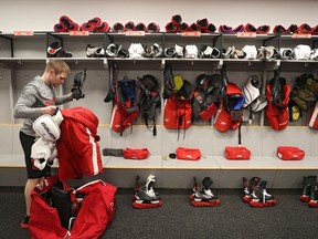 Head Equipment Manager Paul Boyer of the Detroit Red Wings packs a stick bag after the Detroit Red Wings against the Washington Capitals game was postponed due to the coronavirus at Capital One Arena on March 12, 2020 in Washington, DC. Today the NHL announced is has suspended their season due to the uncertainty of the coronavirus (COVID-19) with hopes of returning. The NHL currently joins the NBA, MLS, as well as, other sporting events and leagues around the world suspending play because of the coronavirus outbreak.