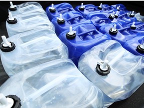 Water jugs bound for Detroit are seen in the back of a truck in Windsor on July 24, 2014.