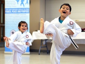 Kids kicking cancer
Seven-year-old patient Kyle Ianni, right, performs martial arts along with his sister Summer Ianni, 4, on Monday during the Transition to Betterness Kids Kicking Cancer belting ceremony hosted by the Transition to Betterness at the Hospice of Windsor Essex.