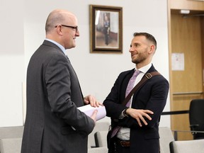 Windsor Mayor Drew Dilkens, left, speaks with Andrew Teliszewsky, 38, newly appointed Chief of Staff at City Council Meeting Monday March 2, 2020.