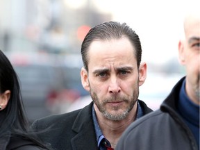 Surrounded by supporters, Michael Hiller, 45, leaves Superior Court of Justice in downtown Windsor on Tuesday, March 3, 2020, after his second day on the witness stand. The Windsor man is on trial and charged with assault and manslaughter for the March 29, 2018, death of Lakeshore district fire chief Joe St. Louis, 51, following a confrontation between the two men in Windsor on March 24, 2018.