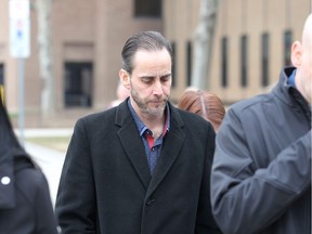 Surrounded by supporters, Michael Hiller, 45, leaves Superior Court of Justice in downtown Windsor on Tuesday, March 3, 2020, after his second day on the witness stand. The Windsor man is on trial and charged with assault and manslaughter for the March 29, 2018, death of Lakeshore district fire chief Joe St. Louis, 51, following a confrontation between the two men in Windsor on March 24, 2018.