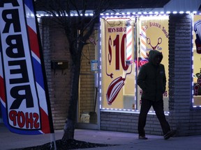 Bright LED lights decorate this barber shop and several other businesses on Ottawa Street Wednesday.