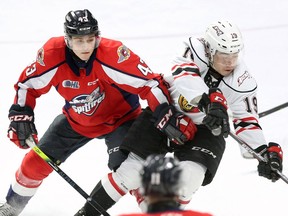 Windsor Spitfires' defenceman Louka Henault, left, is hoping for a different result in his second time through the NHL Draft process.