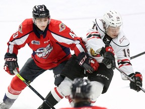 Windsor Spitfires' defenceman Louka Henault, left, remains tied to the NHL's Anaheim Ducks and is now with the team's AHL San Diego Gulls farm team.