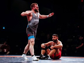 Tecumseh's Jordie Steen (standing) has earned a spot on Canada's 2020 Olympic wrestling team.