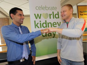 Dr. Amit Bagga, left, greets dialysis patient Nathan Boutcher, 28, with a more acceptable fist pump rather than a hand shake during World Kidney Day display at Ouellette Campus of Windsor Regional Hospital Thursday. Dr. Bagga points out that the goal this year is "the prevention of kidney problems. Avoiding the handshake is probably one of best mechanisms to combat and prevent infections," he said.