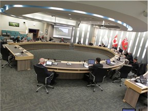 Members of Essex County Council practise social distancing amid the COVID-19 pandemic during a regular council meeting on Wednesday, March 18, 2020.