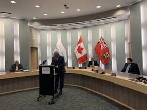Essex County Warden Gary McNamara signs declaration of state of emergency in response to COVID-19 supported by the mayors of Essex County municipalities. Mayors Tom Bain of Lakeshore, Marc Bondy of LaSalle, and Aldo DiCarlo of Amherstburg look on.