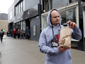 Mike, 29, purchased cannabis products at  J. Supply Co., Windsor's first cannabis retail store located in the heart of the downtown, 500 block of Ouellette Avenue Saturday.