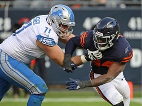 After three seasons with the club, the Detroit Lions cut right tackle Rick Wagner, left, on Friday. Here he's seen in action against the Chicago Bears.