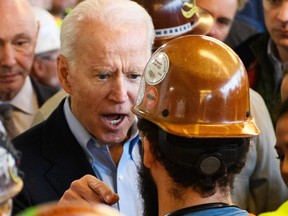 Democratic presidential candidate Joe Biden meets workers as he tours the Fiat Chrysler plant in Detroit, Michigan on March 10, 2020.