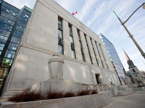 The Bank of Canada building in Ottawa. The Bank of Canada on Friday lowered a key interest rate to 0.25 per cent as part of a drive to cushion the impact of the coronavirus pandemic.