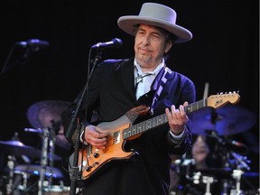 In this file photo taken on July 22, 2012, Bob Dylan performs during a music festival in Carhaix-Plouguer, France. Dylan surprised fans on March 27, 2020, by releasing his first original music in eight years, a 17-minute ballad about the assassination of John F. Kennedy.